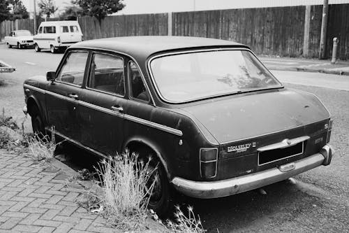 A Grayscale of a Parked Vintage Car