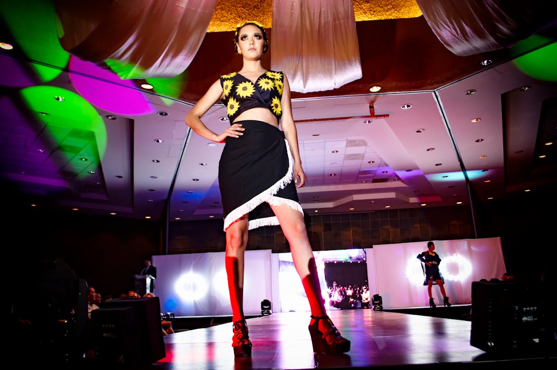 Free Woman Standing on Stage With Hands on Waist Stock Photo