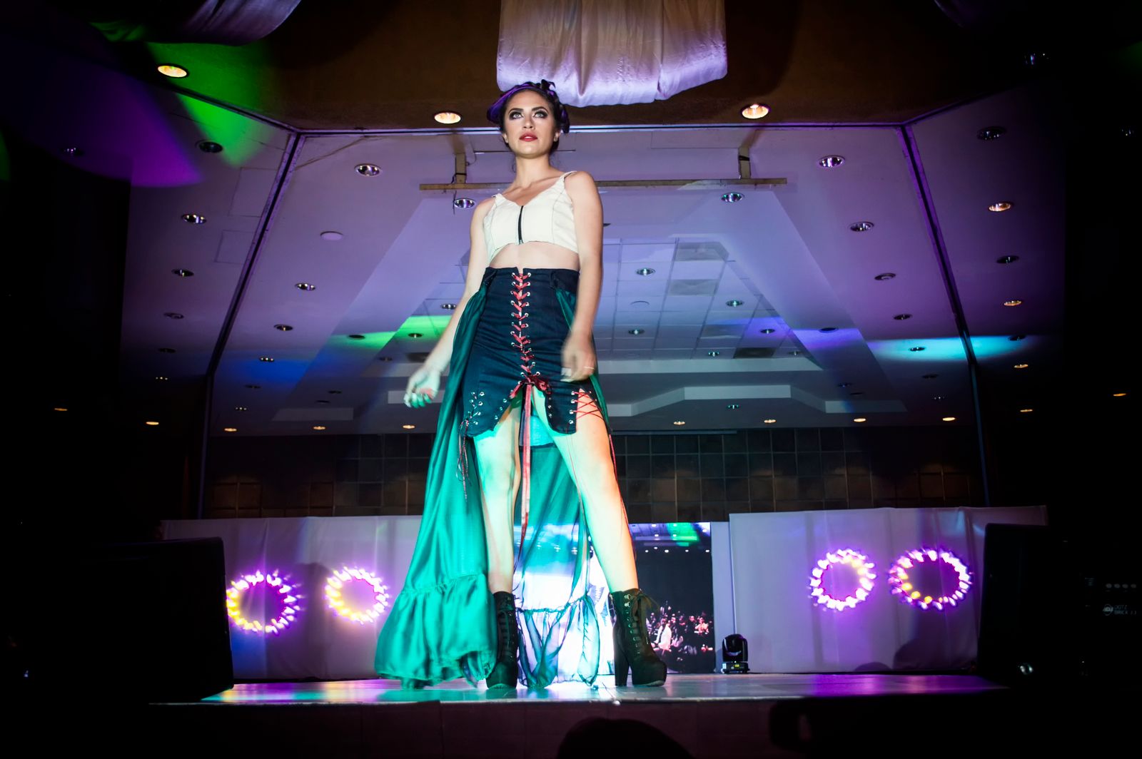 Fashion model on runway during evening event