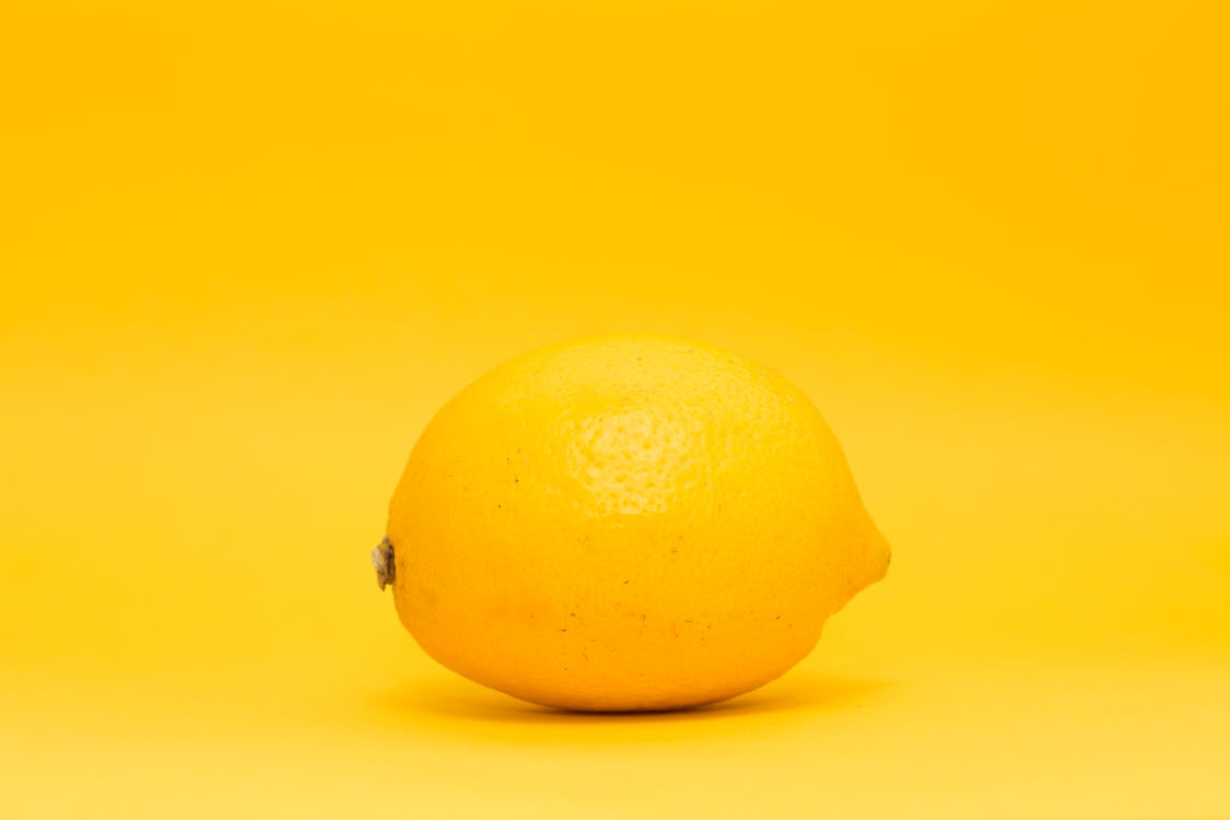 Free Yellow Lemon Fruit on White Surface Stock Photo