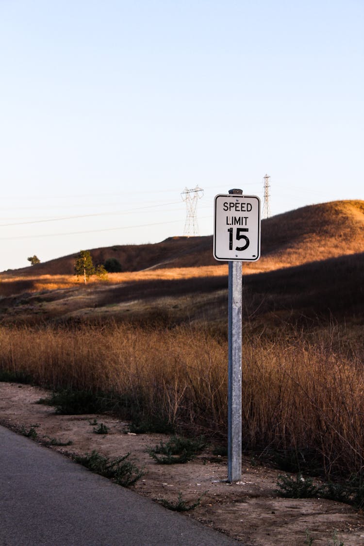 Photo Of A Speed Limit Signage Near The Grass