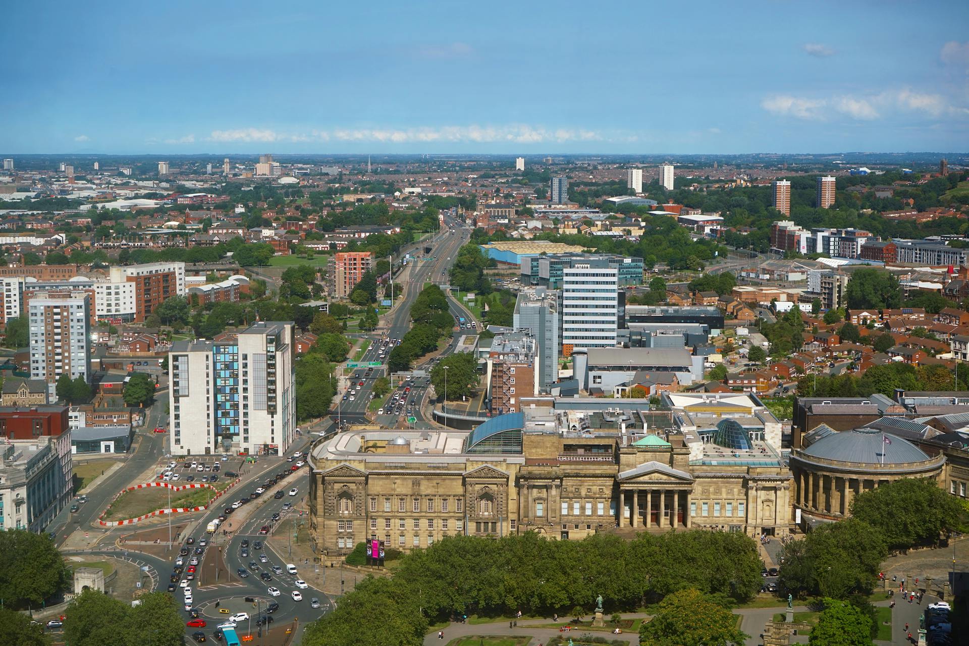 Stunning aerial view of Liverpool cityscape featuring historical architecture and modern buildings.