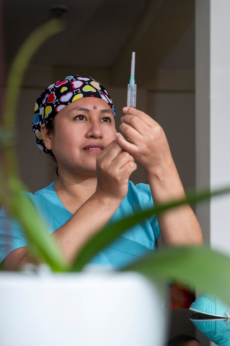 Woman Holding Syringe