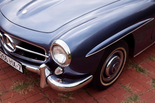 Close Up Photo of Blue Classic Car