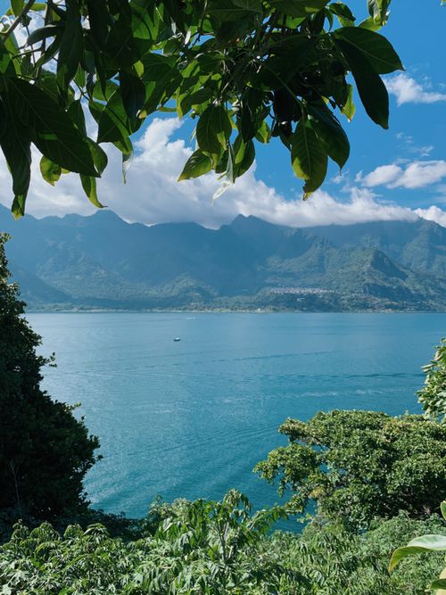 Free A breathtaking view of Lake Atitlán surrounded by mountains in San Pedro La Laguna, Guatemala. Stock Photo
