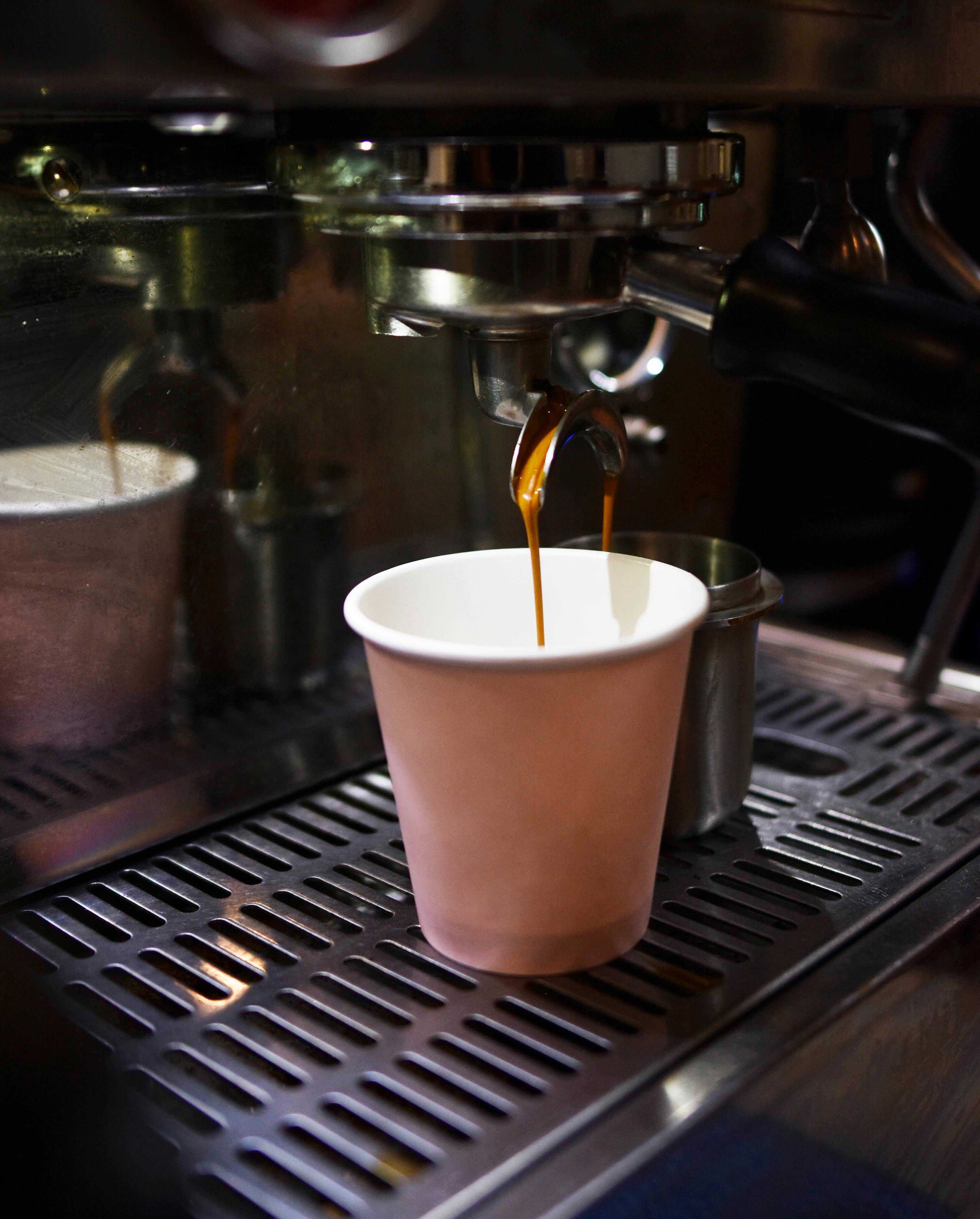 A Paper Cup on Coffee Machine with Portafilter · Free Stock Photo