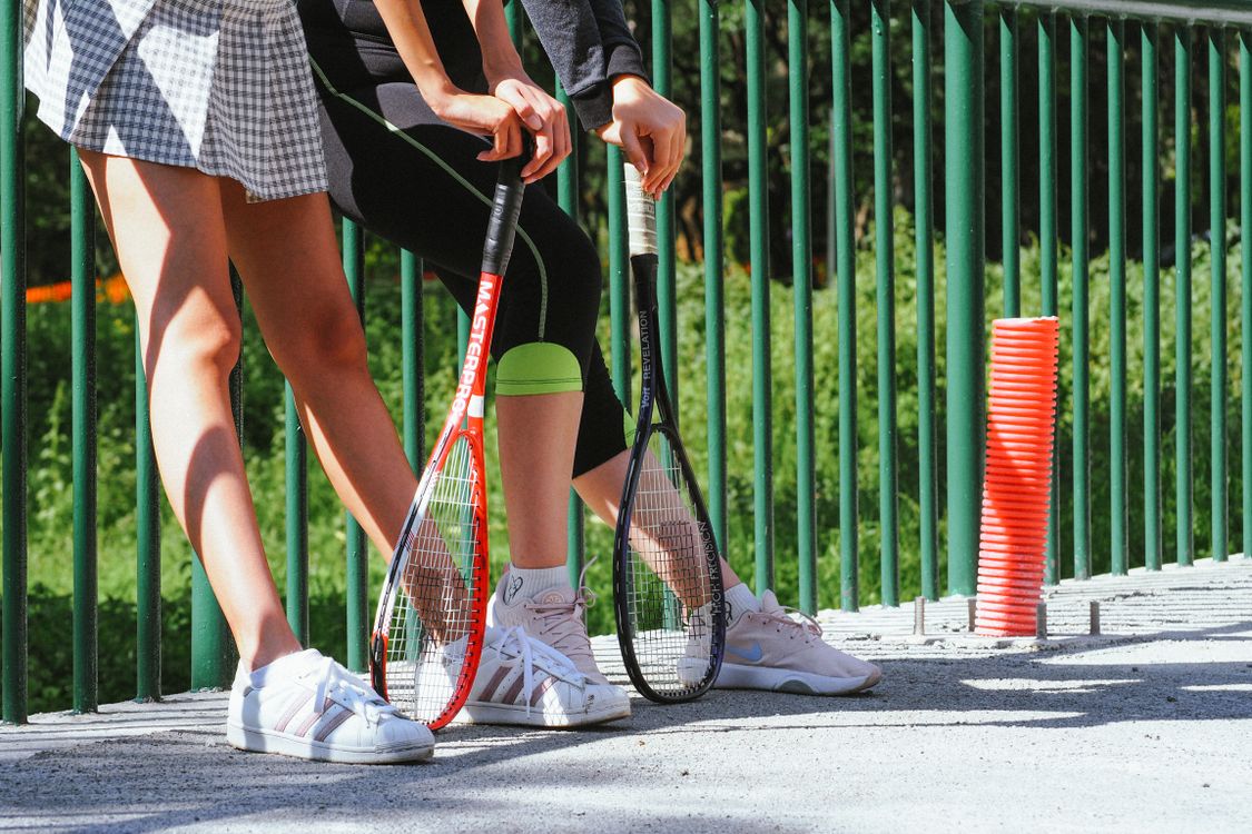 Women Hands Holding Tennis Rackets · Free Stock Photo