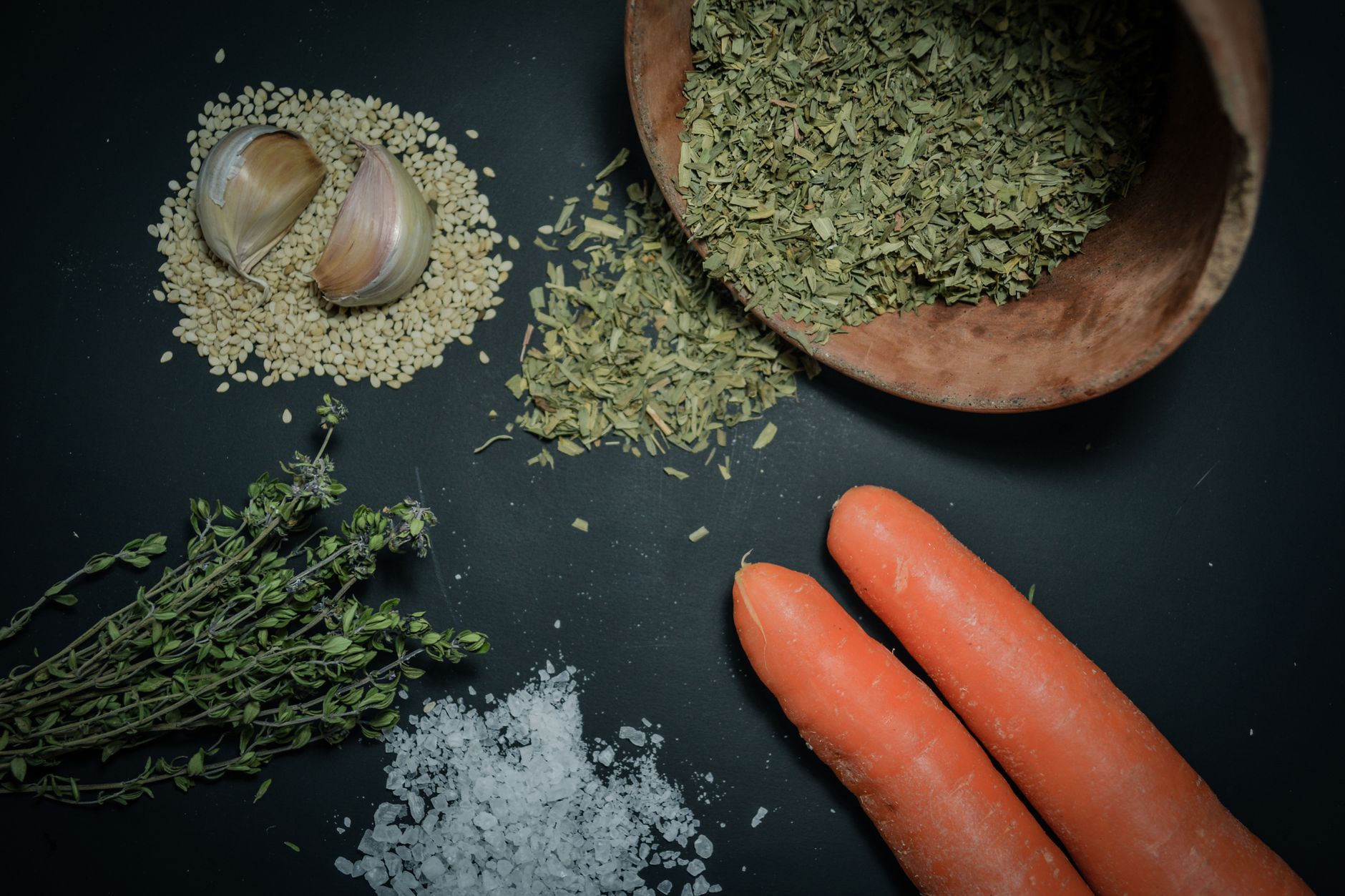 Mixing dried herbs and spices to make vegetable seasoning