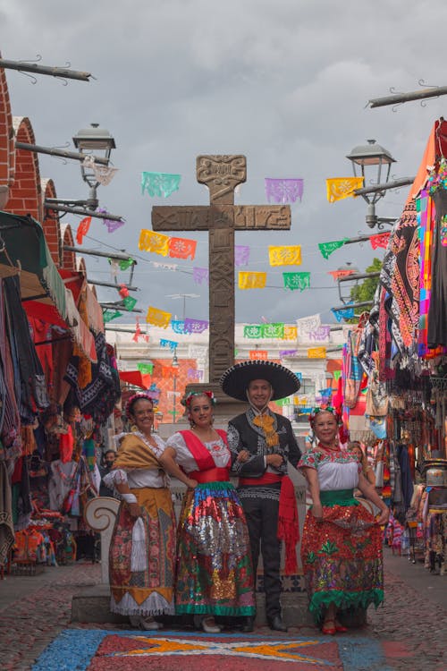 People in Traditional Wear Standing on Street