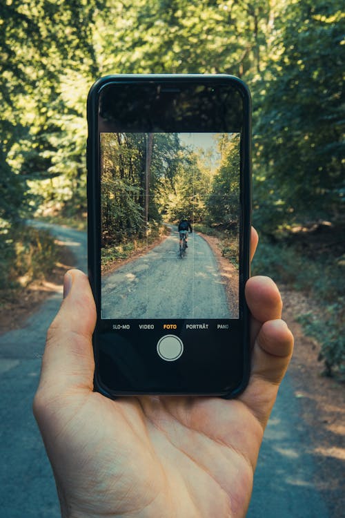 Person Holding a Black Cellphone