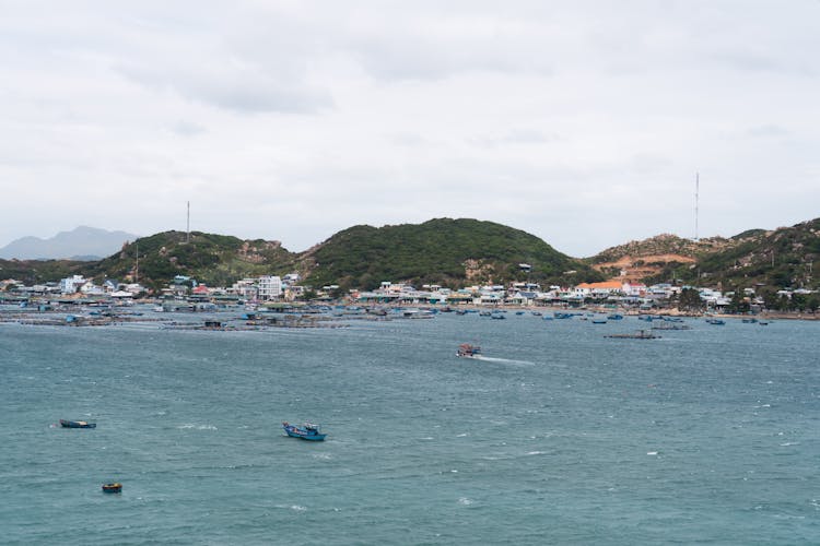 Drone Shot Of Watercrafts Near An Island