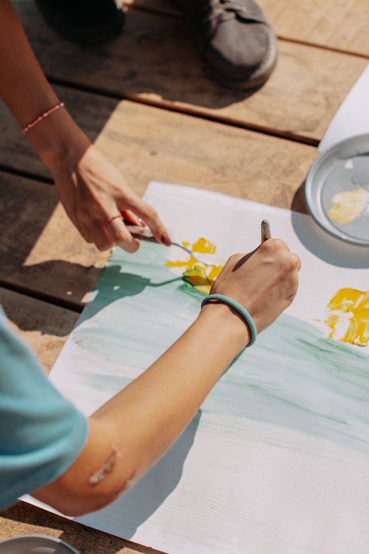 Painters Painting On A Canvas