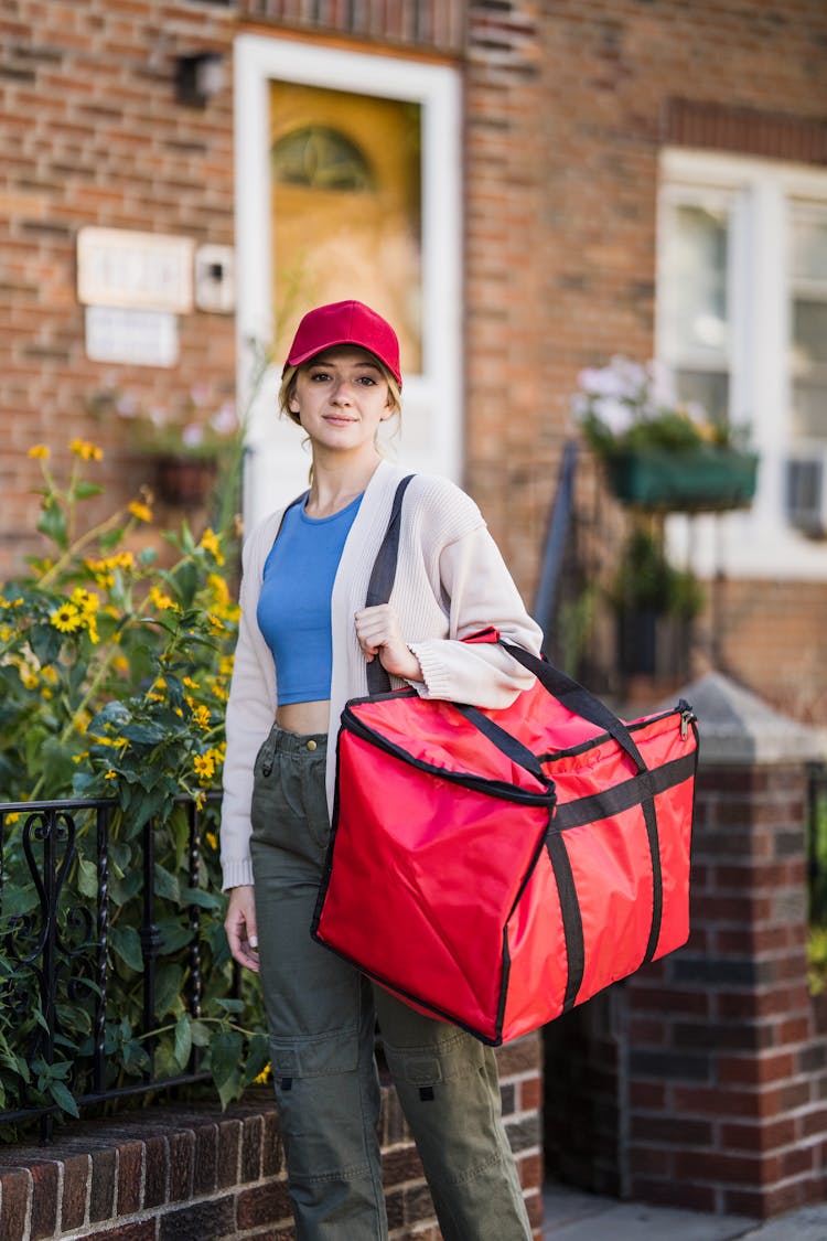 Young Smiling Woman From Food Delivery Service