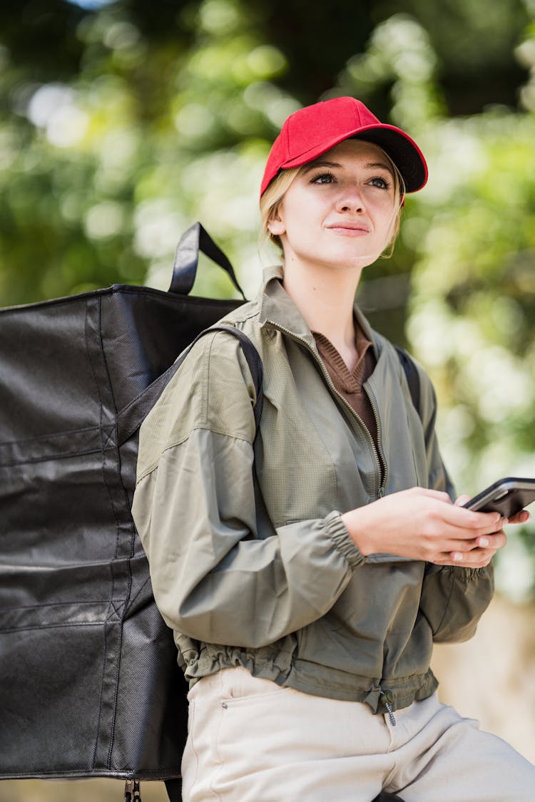 Woman In Jacket With Black Backpack