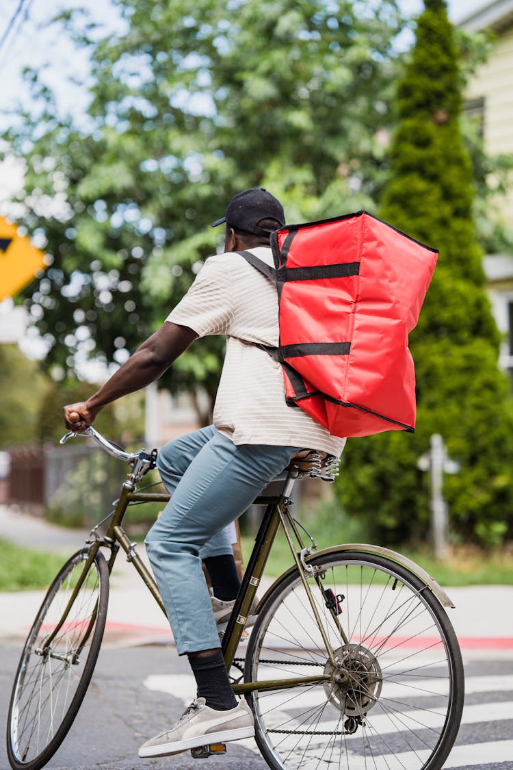 Cyclist With Red Backpack