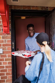 A joyful exchange between a deliveryman and a customer at the doorstep.
