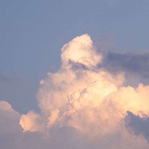 Cloud formations in soft golden sunset light — photo by Nicola Ni on Pexels