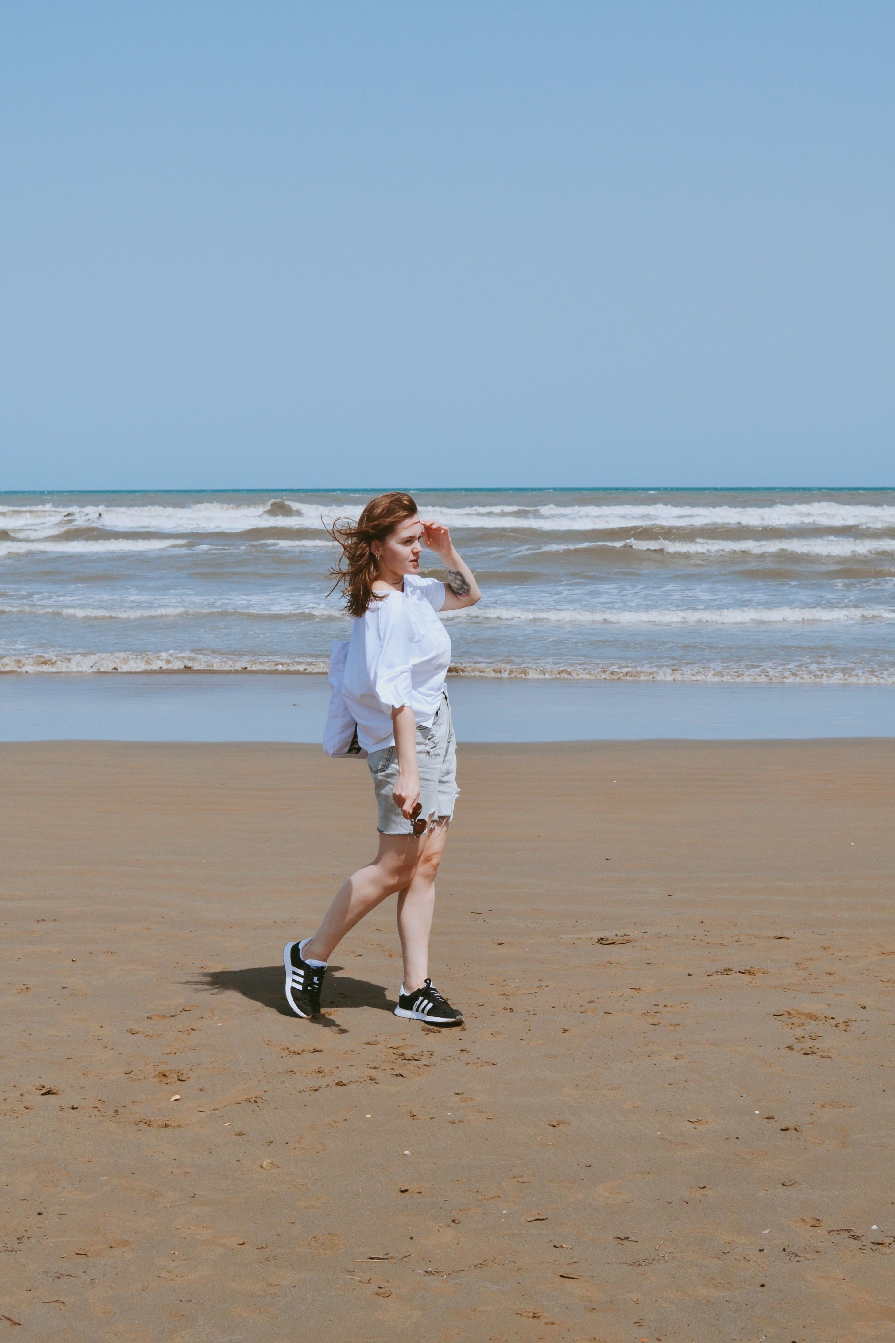 Woman Walking on the Beach · Free Stock Photo