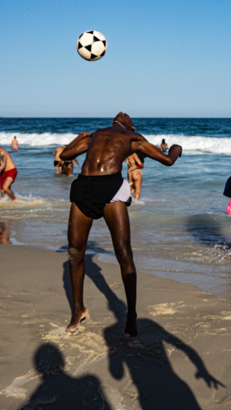 Man In Black Shorts Playing Soccer