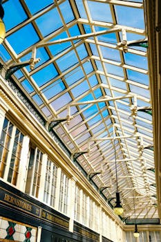 Beautiful perspective of a historic shopping gallery with glass roof and classic details.
