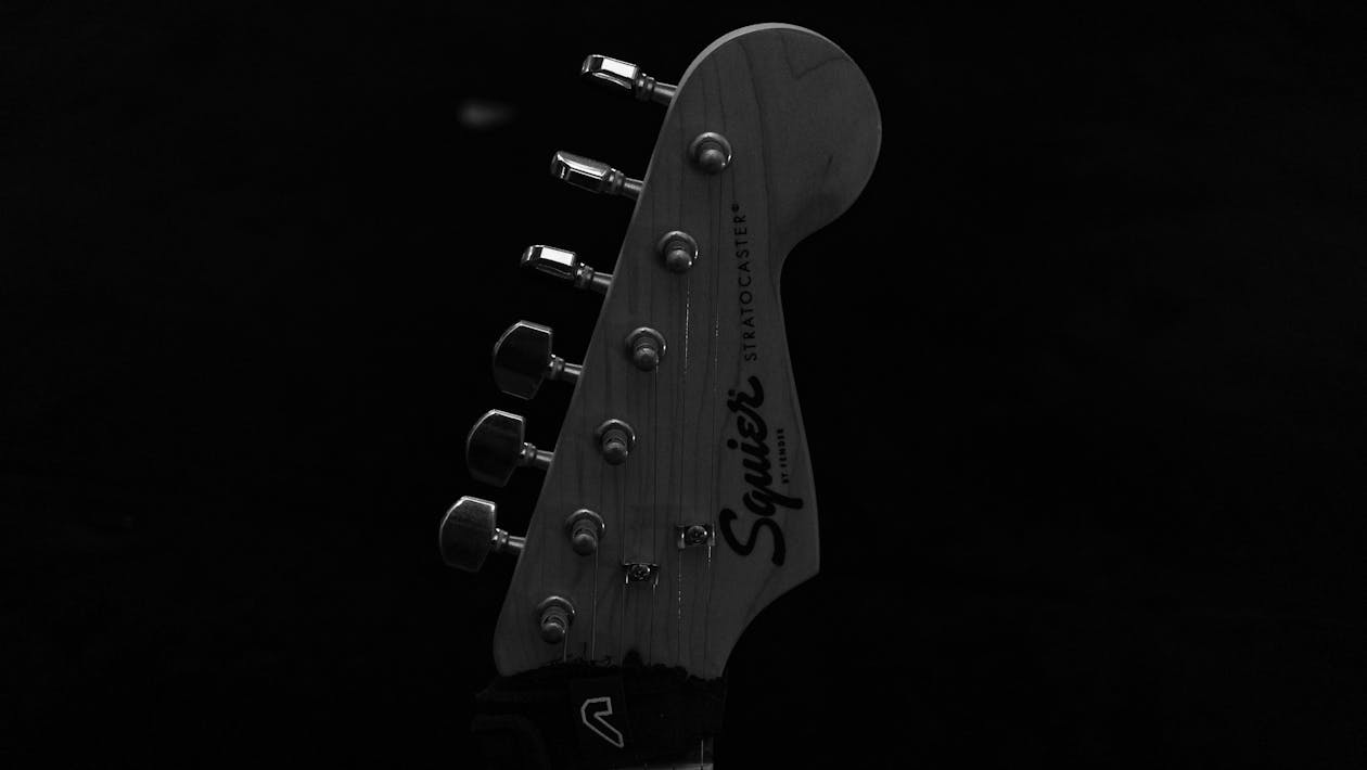 Grayscale Photo of a Guitar Headstock · Free Stock Photo