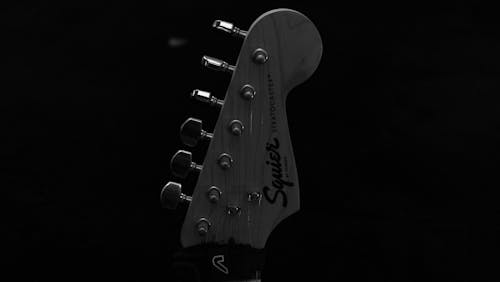 Grayscale Photo of a Guitar Headstock