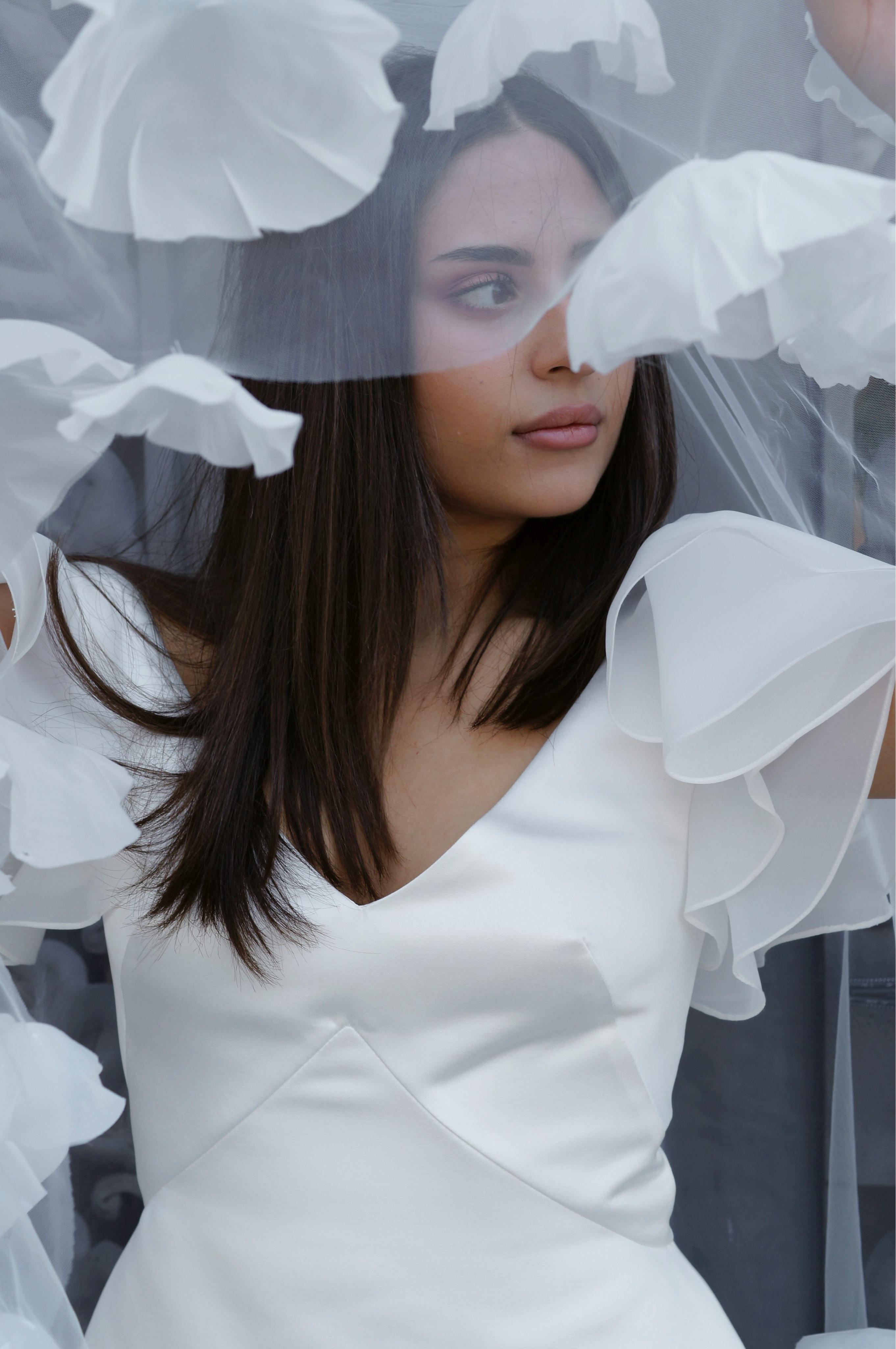 woman in white dress with white veil