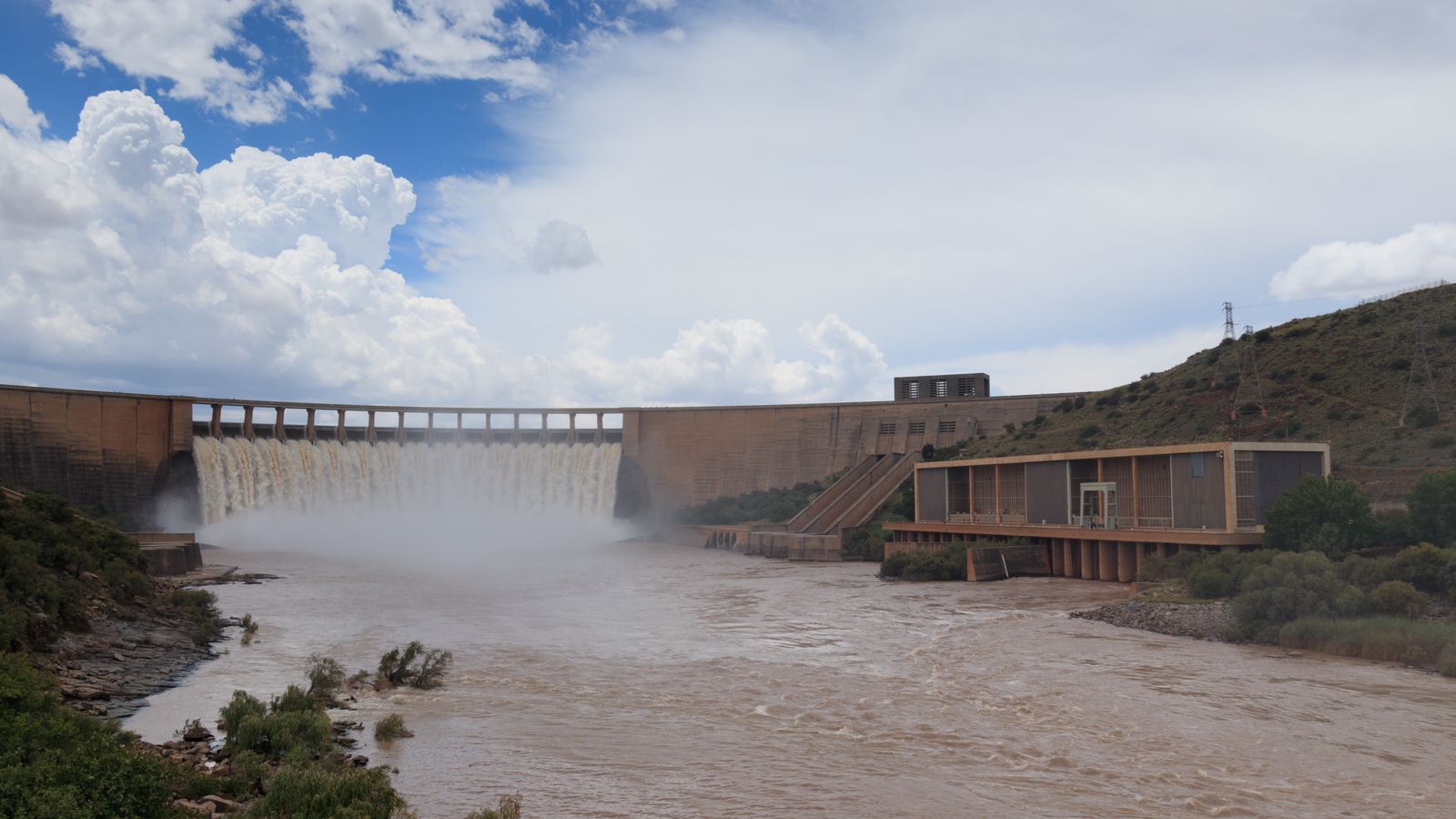 Water falls under blue sky and white clouds, South Africa