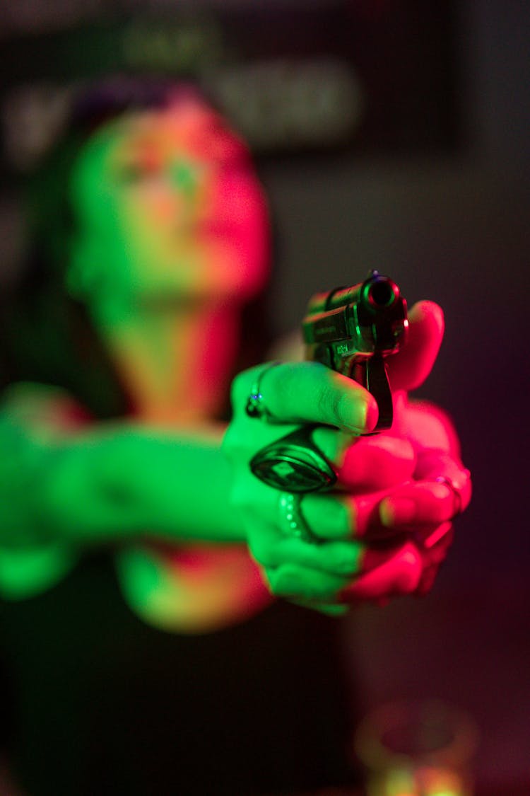 Woman Pointing A Gun 