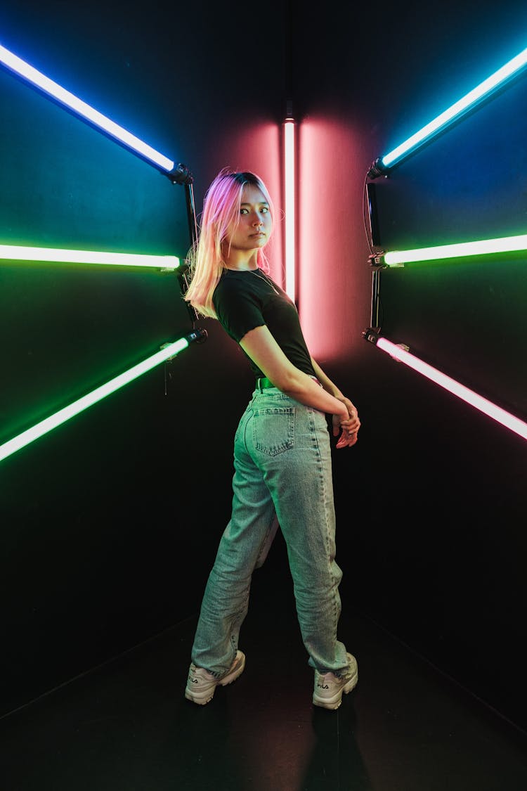 Girl With Pink Hair Posing In Studio With Neon Lights