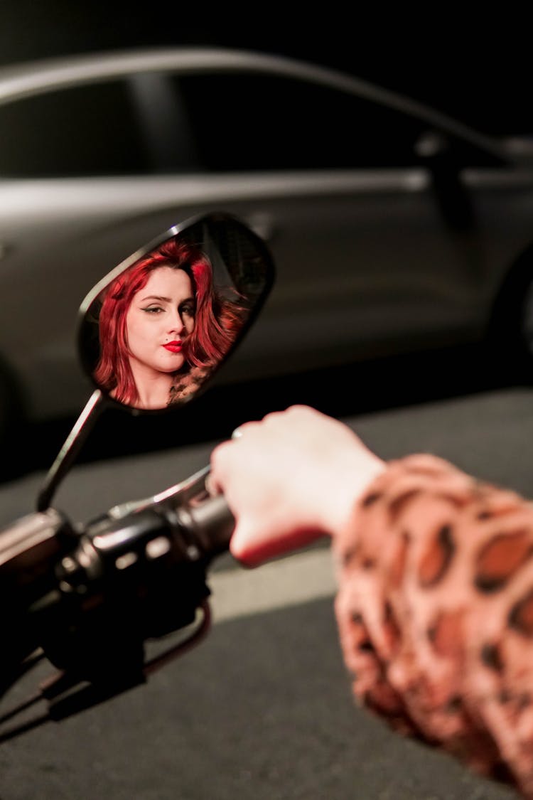 Woman Face In Motorcycle Mirror