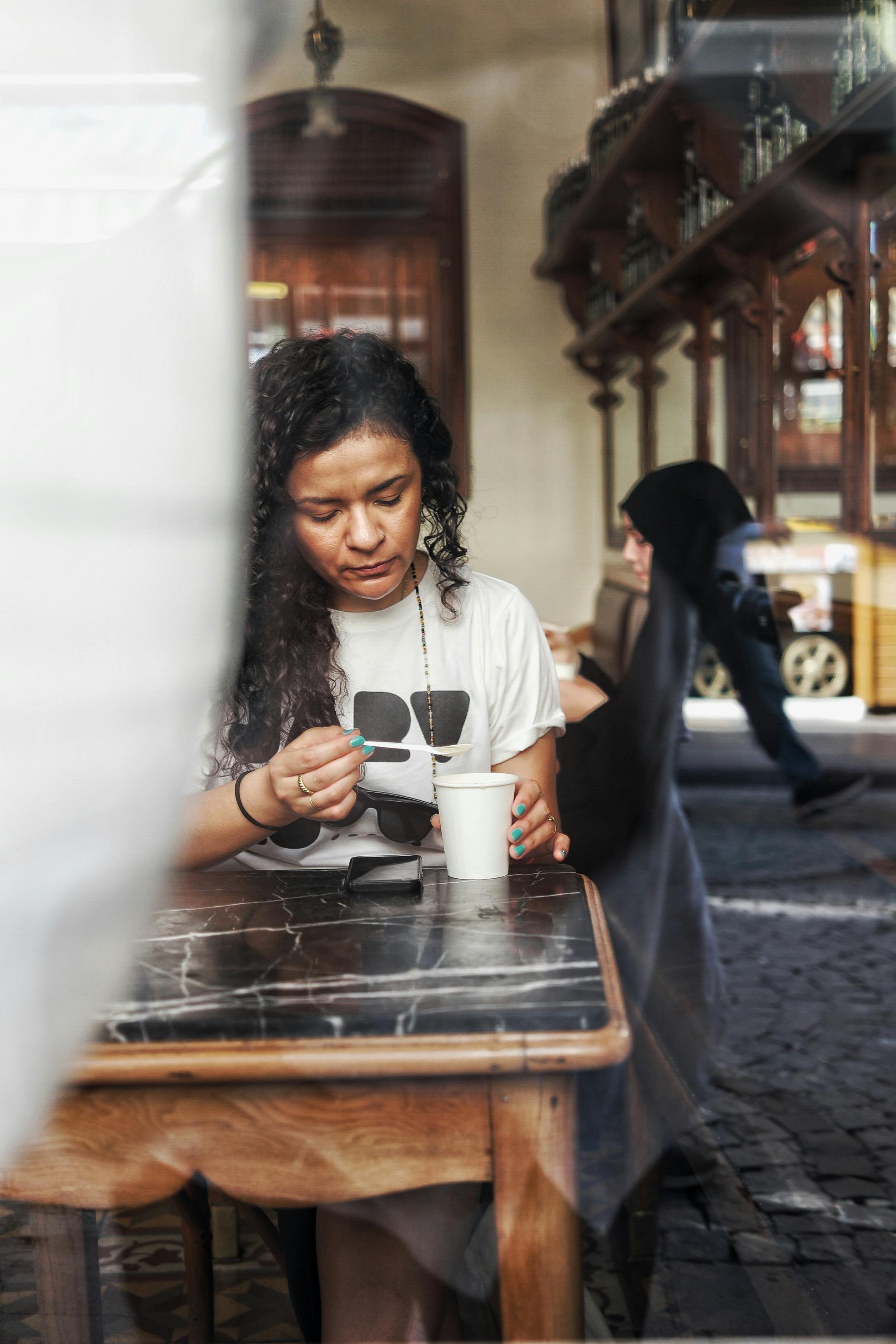 woman mixing her drink