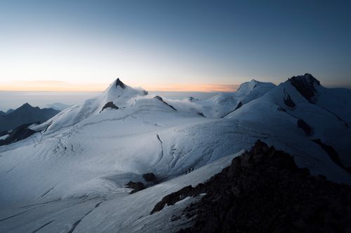 Free Scenic view of snowy Alps during sunrise, capturing serene beauty and majestic peaks. Stock Photo