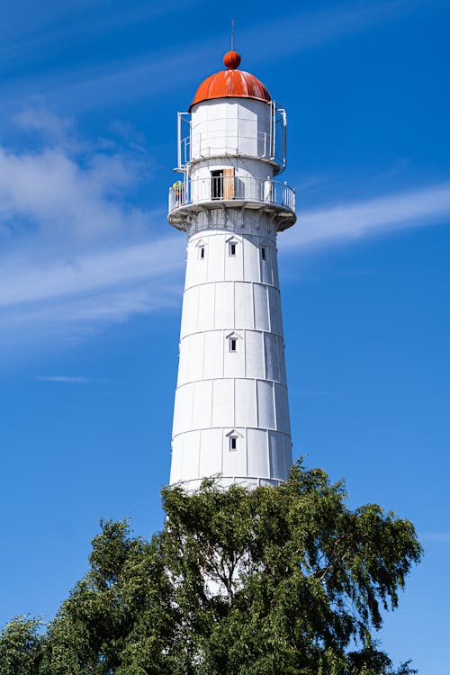 White Lighthouse Under Blue Sky