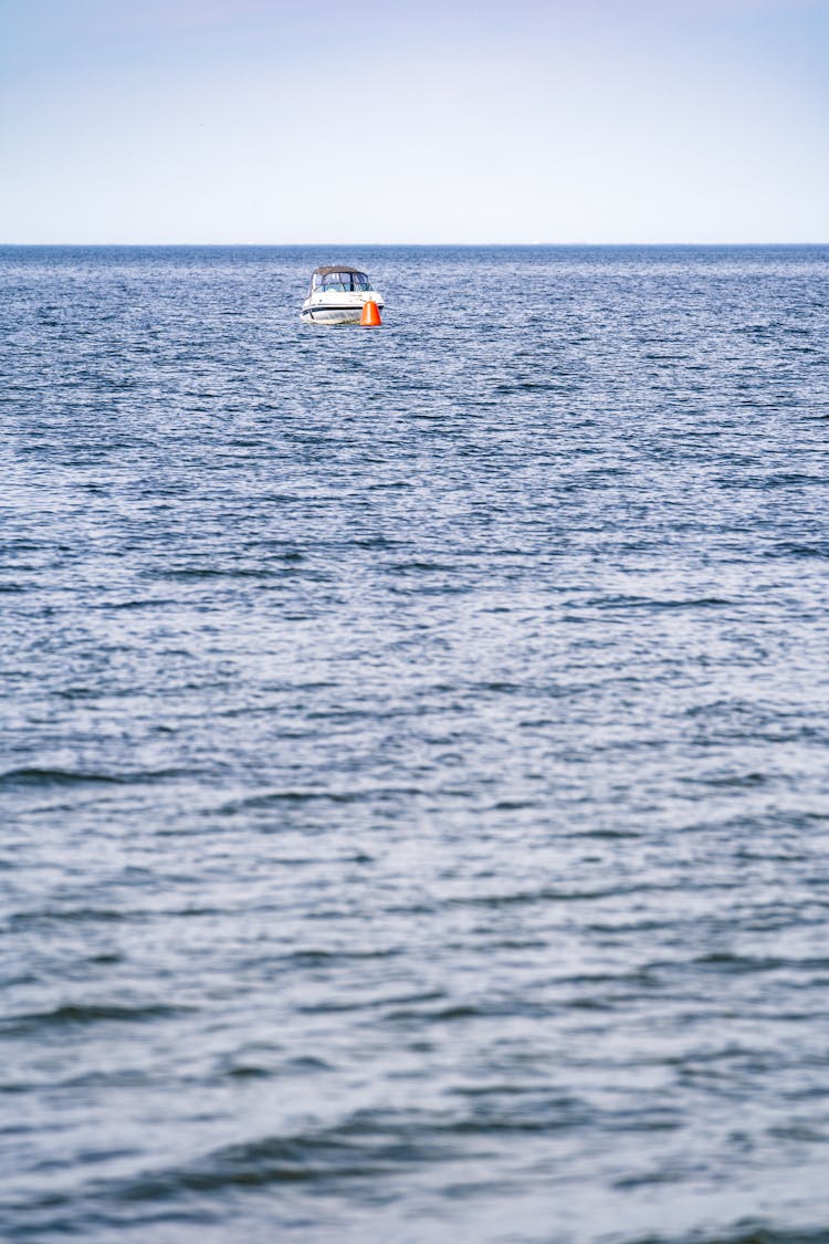 White Boat Sailing On The Sea