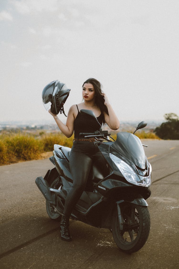 Woman With Helmet On Motorcycle