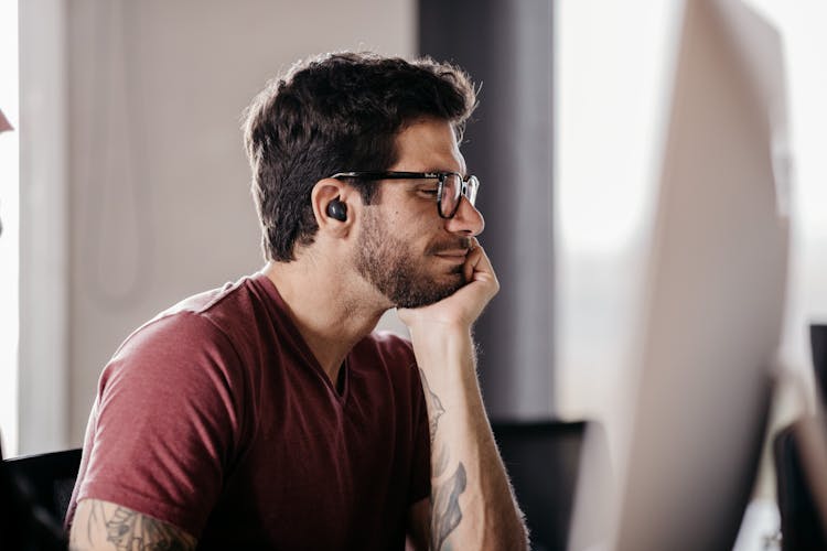 Man With Tattoos At Work