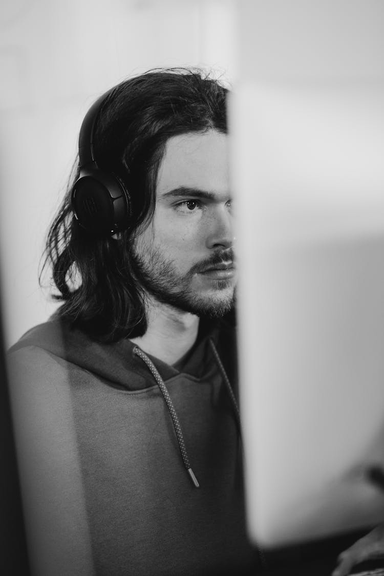 Black And White Portrait Of Man Working On Computer