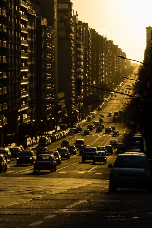Free Capture the vibrant city life and architecture of Mar del Plata during sunset, highlighting busy streets and skyscrapers. Stock Photo
