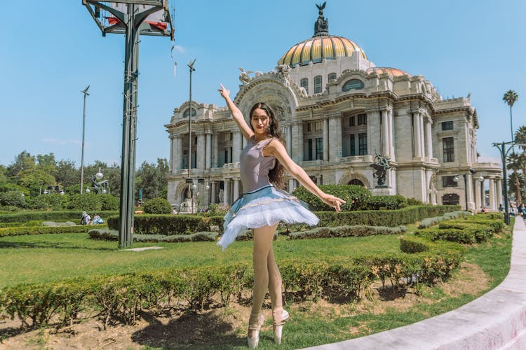 Ballet Dancer Posing At A Garden