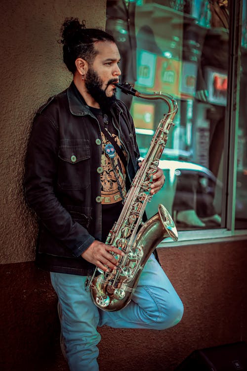 A Street Musician Playing a Saxophone 