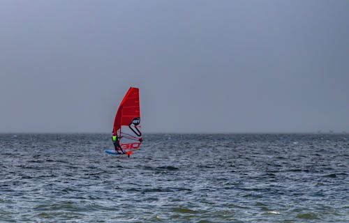 Man Windsurfing on Sea