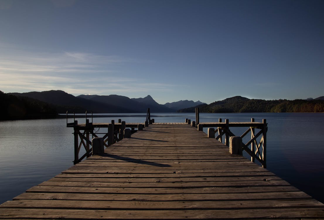 Brown Wooden Dock on Body of Water · Free Stock Photo