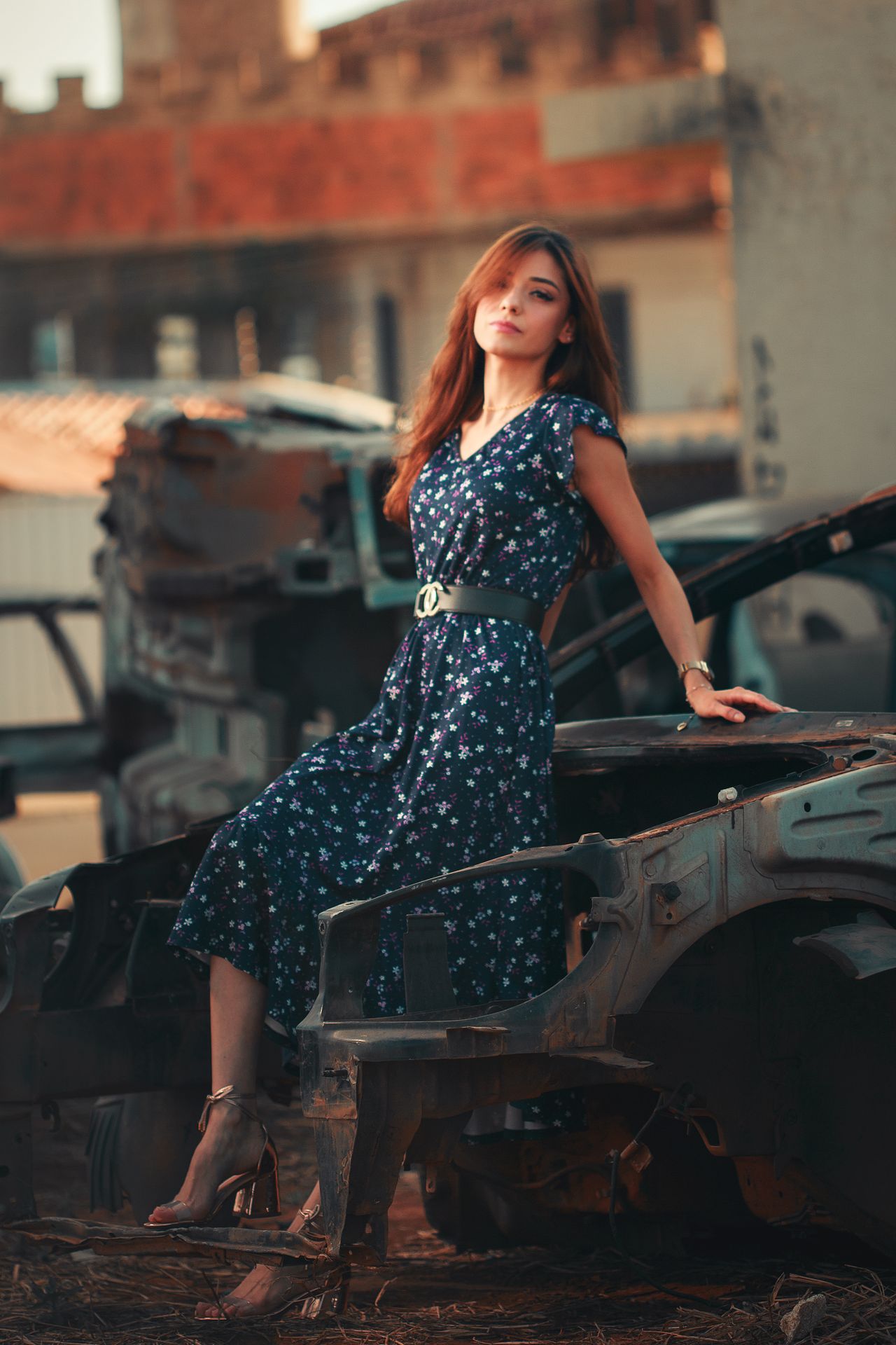 Woman in a floral midi dress with a belt