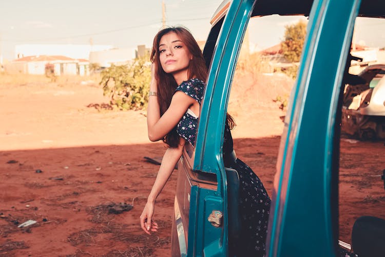 Woman Leaning Out Of A Car 