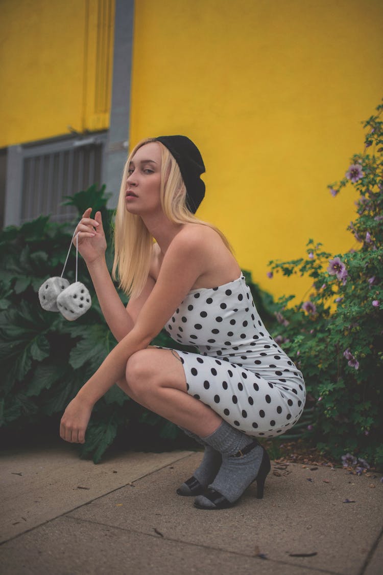 Sexy Woman In Dots Dress Posing Outdoors