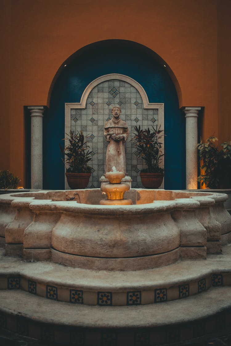 Photo Of A Fountain And A Sculpture 