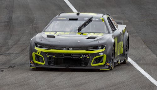 Black Chevrolet Camaro Driving on a Race Track