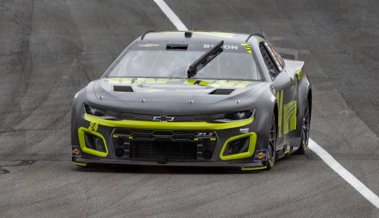 Black Chevrolet Camaro Driving On A Race Track