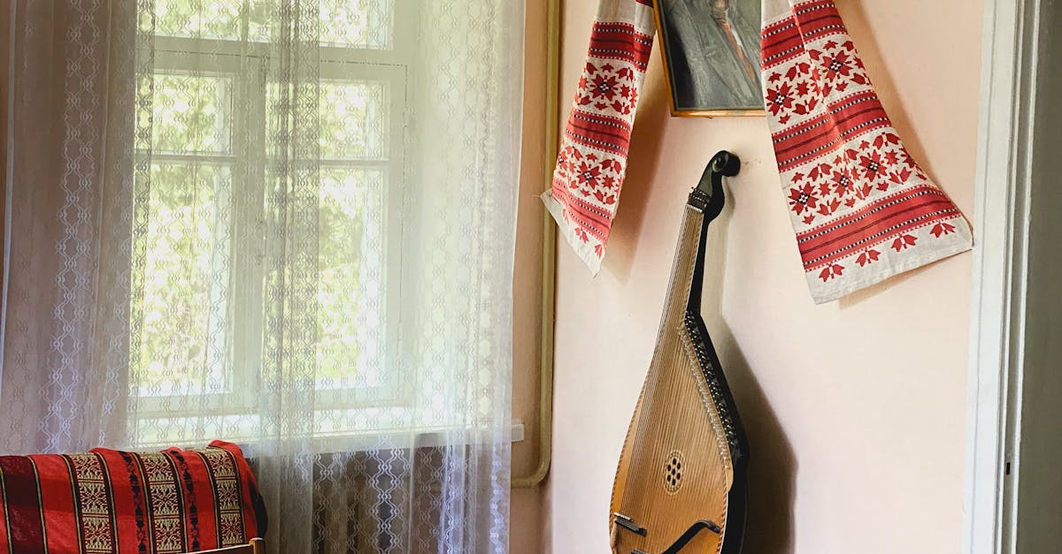 Stringed Musical Instrument on Brown Table · Free Stock Photo